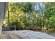 Backyard deck features a chiminea and privacy from the mature trees at 213 Factors Walk, Summerville, SC 29485