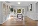Sunlit dining room featuring a modern table setting, elegant decor, and a large bay window at 213 Factors Walk, Summerville, SC 29485