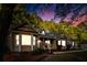 Charming single-story home with inviting front porch, bay windows, and lush greenery surrounding the property at 213 Factors Walk, Summerville, SC 29485