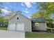 Detached two car garage featuring a gabled roof and vertical siding at 213 Factors Walk, Summerville, SC 29485