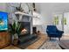 Stylish living room with stone fireplace, hardwood floors, built-in shelving, and cozy furniture at 213 Factors Walk, Summerville, SC 29485
