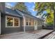 Home exterior featuring a sunroom with many windows and a wooden deck at 213 Factors Walk, Summerville, SC 29485