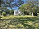 Sprawling backyard view with the house in the background, showcasing the large outdoor space at 217 Scotia St, McClellanville, SC 29458