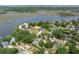 Scenic aerial view of a coastal community with waterfront properties, surrounded by lush landscapes and river at 2187 Saint James Dr, Charleston, SC 29412