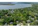 Stunning aerial view showcasing the neighborhood's lush greenery and waterfront access, with a river view at 2187 Saint James Dr, Charleston, SC 29412