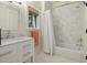 Clean bathroom featuring a marble vanity, a window, and a shower-tub combination at 2187 Saint James Dr, Charleston, SC 29412