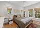 Comfortable bedroom with hardwood floors, ample natural light, and neutral decor at 2187 Saint James Dr, Charleston, SC 29412