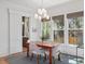 Bright dining room boasts natural light with large windows and a modern light fixture at 2187 Saint James Dr, Charleston, SC 29412