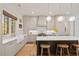 Elegant kitchen with farmhouse sink, marble countertops, and modern pendant lighting at 2187 Saint James Dr, Charleston, SC 29412