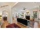 Bright living room with fireplace, hardwood floors, and seamless flow to the dining area at 2187 Saint James Dr, Charleston, SC 29412
