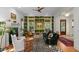 Inviting living room featuring built-in bookshelves, a fireplace, and stylish decor at 2187 Saint James Dr, Charleston, SC 29412