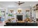 Cozy living room with a fireplace, built-in shelving, and a comfortable seating arrangement at 2187 Saint James Dr, Charleston, SC 29412