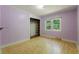 Bedroom featuring hardwood floors, a built-in closet, and a window at 2234 River Rd, Johns Island, SC 29455