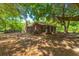Charming single-story brick home with a covered porch and mature trees at 2234 River Rd, Johns Island, SC 29455