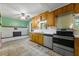 Classic kitchen features a fireplace, wood cabinets, stainless steel appliances, and ample storage at 2234 River Rd, Johns Island, SC 29455