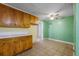 Kitchen with wooden cabinets and countertops, ceiling fan and doorway leading to an adjacent room at 2234 River Rd, Johns Island, SC 29455