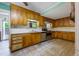 Functional kitchen with wood cabinets, stainless appliances, and plenty of countertop space at 2234 River Rd, Johns Island, SC 29455