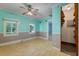 Spacious living area featuring a ceiling fan, light-filled windows, and an open layout at 2234 River Rd, Johns Island, SC 29455