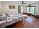 Comfortable bedroom with hardwood floors, natural light, and a stylish sliding barn door at 224 Reeves St, Reevesville, SC 29471