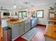 Open kitchen featuring light gray cabinets, butcher block countertops, and stainless appliances at 224 Reeves St, Reevesville, SC 29471
