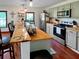 Well-lit kitchen with a breakfast bar, stainless steel appliances, and modern cabinetry at 224 Reeves St, Reevesville, SC 29471
