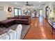 Spacious living room with hardwood floors seamlessly flowing into the open kitchen at 224 Reeves St, Reevesville, SC 29471