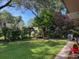 Lush backyard features mature trees, a picnic table, and a grassy area at 2331 Furman Dr, Charleston, SC 29414