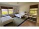 Bright bedroom features twin beds, large windows, and stylish decor, creating a comfortable space at 2331 Furman Dr, Charleston, SC 29414