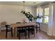 Bright dining room with a stylish table, modern lighting, and a leafy houseplant at 2331 Furman Dr, Charleston, SC 29414