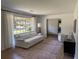Comfortable living room with a plush sofa, accent chair, and lots of natural light at 2331 Furman Dr, Charleston, SC 29414