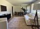 Combined living and dining space with large windows for natural light and comfortable seating at 2331 Furman Dr, Charleston, SC 29414