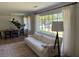 Bright living room, dining room combo with many windows for natural light and comfortable seating at 2331 Furman Dr, Charleston, SC 29414