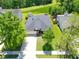 Aerial view of the home with a manicured lawn, mature trees and a spacious driveway at 236 Everwood Ct, Moncks Corner, SC 29461