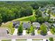An aerial view shows the neighborhood and how the home backs up to a beautiful nature preserve at 236 Everwood Ct, Moncks Corner, SC 29461