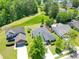 Aerial view of the home nestled in a well-kept neighborhood with mature trees and landscaping at 236 Everwood Ct, Moncks Corner, SC 29461