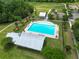 Aerial view of a community pool with ample lounge seating and shaded areas for relaxation at 236 Everwood Ct, Moncks Corner, SC 29461
