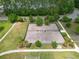 Aerial view of a fenced dog park area with walking paths and green space for residents at 236 Everwood Ct, Moncks Corner, SC 29461