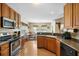 Well-lit kitchen with stainless steel appliances and an open view to the dining area at 236 Everwood Ct, Moncks Corner, SC 29461