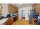 Functional kitchen featuring warm wood cabinets, stainless steel appliances, and easy access to a doorway at 236 Everwood Ct, Moncks Corner, SC 29461