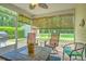 Cozy screened-in porch offering outdoor relaxation with backyard views and ample natural light at 236 Everwood Ct, Moncks Corner, SC 29461