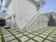 Lush backyard featuring an architectural stone and grass grid and stairs leading to the main house at 2524 Josiah St, Charleston, SC 29492