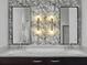 Modern bathroom featuring double sinks, dark cabinets, marble countertop, and stylish wallpaper at 2524 Josiah St, Charleston, SC 29492