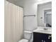 Clean bathroom with a dark vanity, white shower curtain, and a simple, functional design at 2524 Josiah St, Charleston, SC 29492