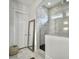 Bright bathroom featuring gray marbled tiling in the shower, and a full length mirror and doorway at 2524 Josiah St, Charleston, SC 29492