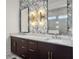 Modern bathroom showcasing a double sink vanity with gold hardware and stylish mirrors and wallpaper at 2524 Josiah St, Charleston, SC 29492