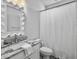 Clean bathroom with a granite vanity, ornate mirror, and neutral white palette at 2524 Josiah St, Charleston, SC 29492