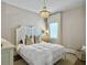 Cozy bedroom with a plush bed, chandelier, and bright window at 2524 Josiah St, Charleston, SC 29492