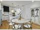 Bright dining area featuring a round table, stylish chairs, and an open view to the kitchen at 2524 Josiah St, Charleston, SC 29492