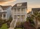Charming two-story home with a double porch and beautiful landscaping at 2524 Josiah St, Charleston, SC 29492