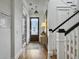 Elegant foyer featuring hardwood floors, a staircase, and a glass-paneled front door at 2524 Josiah St, Charleston, SC 29492